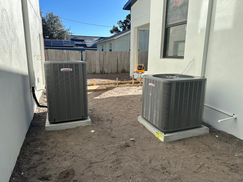 HVAC New construction New Lennox air conditioners installed between two home