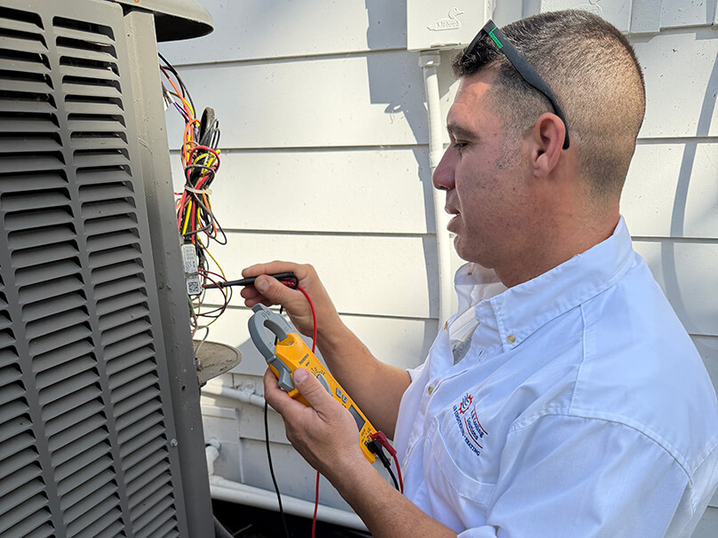 Repair for cities landing pages Service technician doing maintenance on an air conditioner